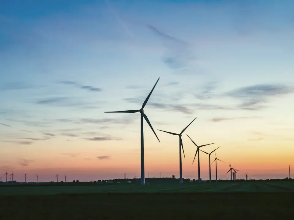Wind turbines on the horizon at golden hour