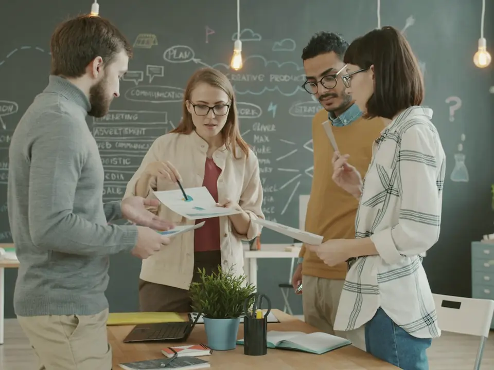 A team reviewing documents together in an office