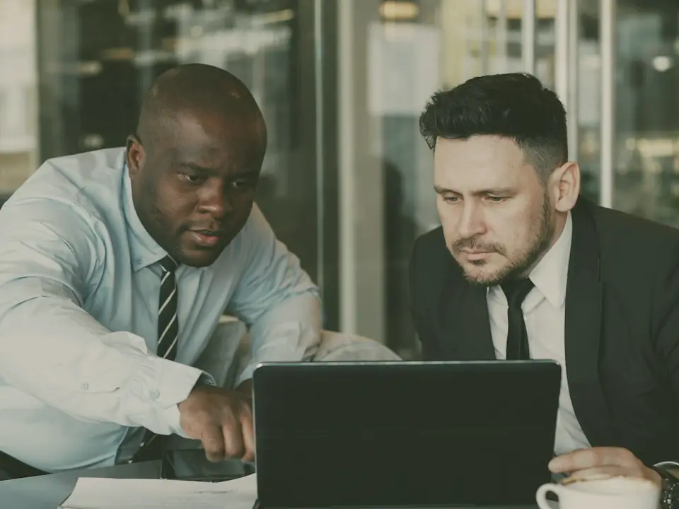 Two people working together at a screen